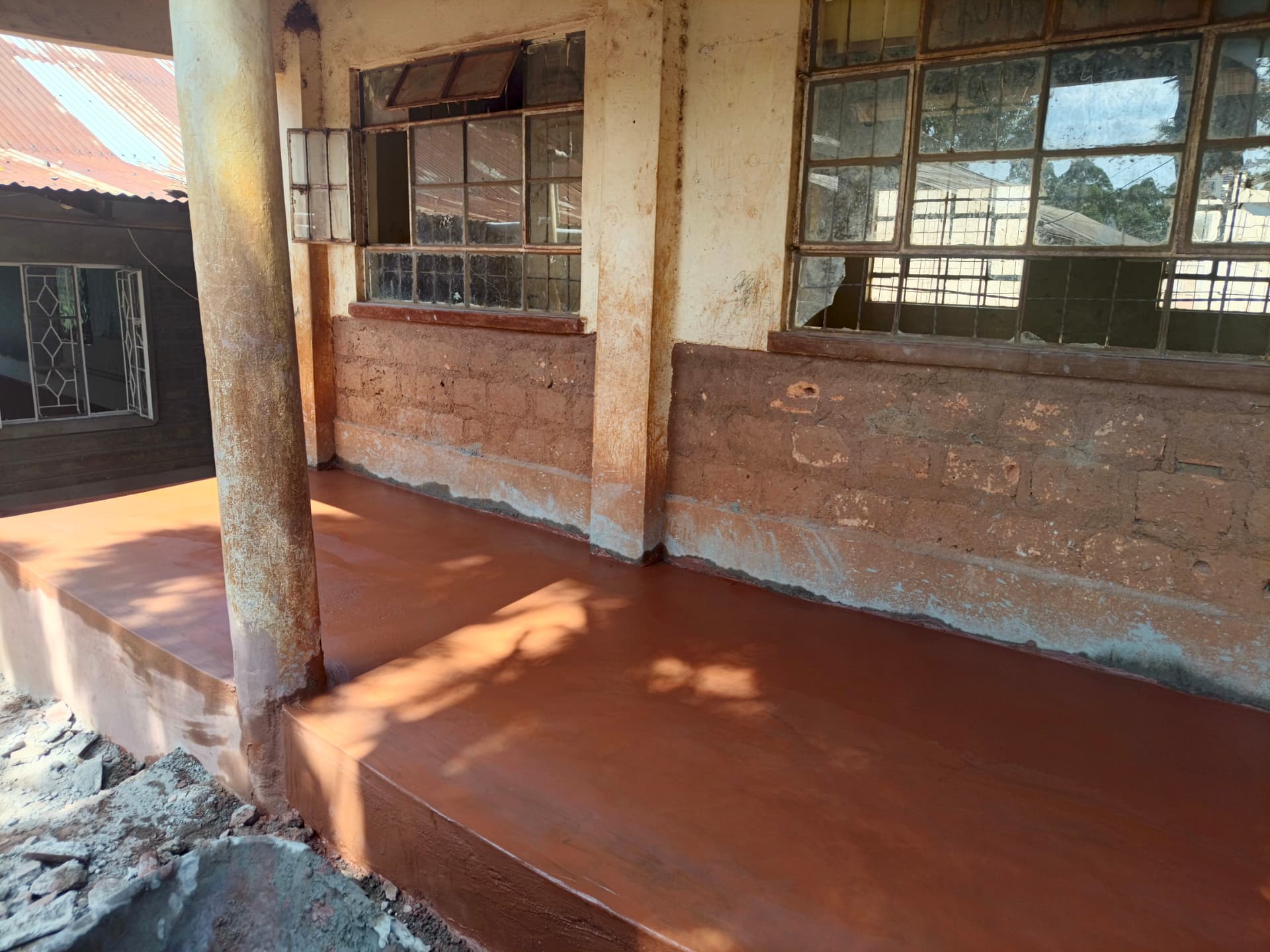 Freshly screeded and sealed classroom veranda floor