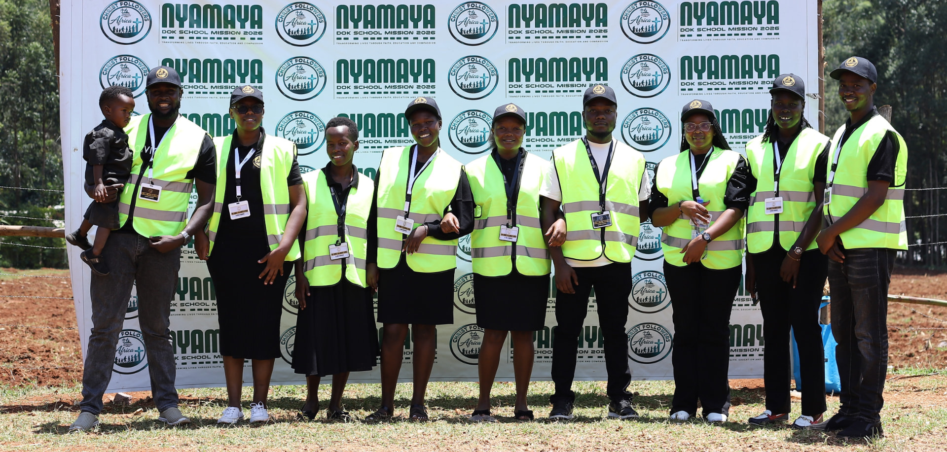 The Christ Followers Africa mission team in front of the Nyamaya DOK School Mission 2026 banner