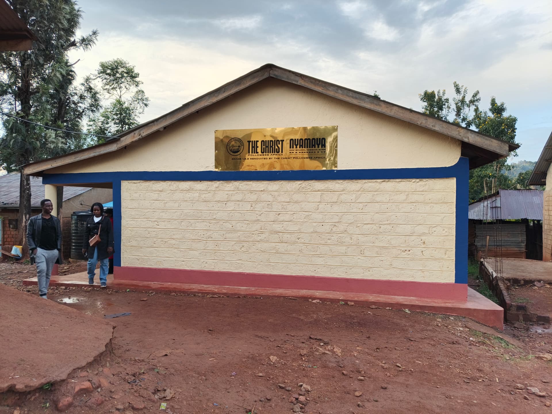 Completed Grade block with the gold Nyamaya DOK School Mission 2026 plaque