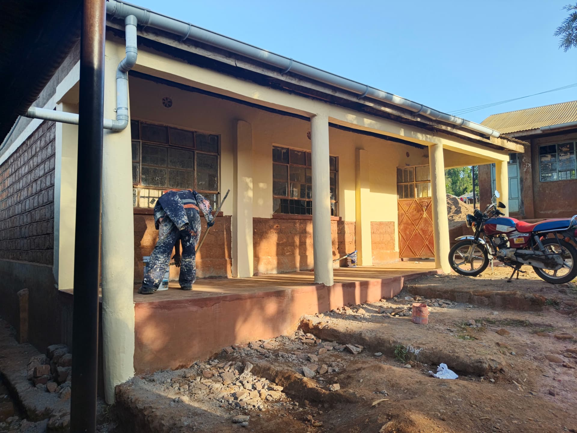 Repainted classroom block exterior with new gutters