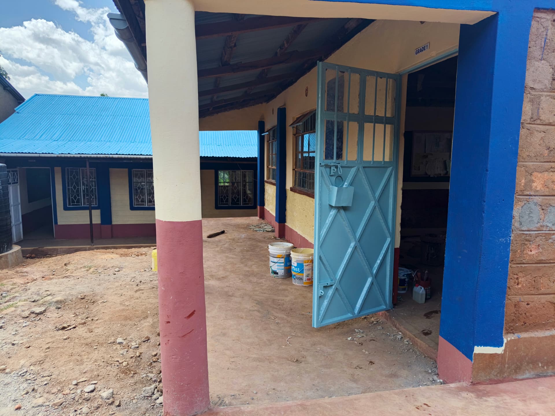 Grade 1 classroom doorway repainted with fresh blue metal door
