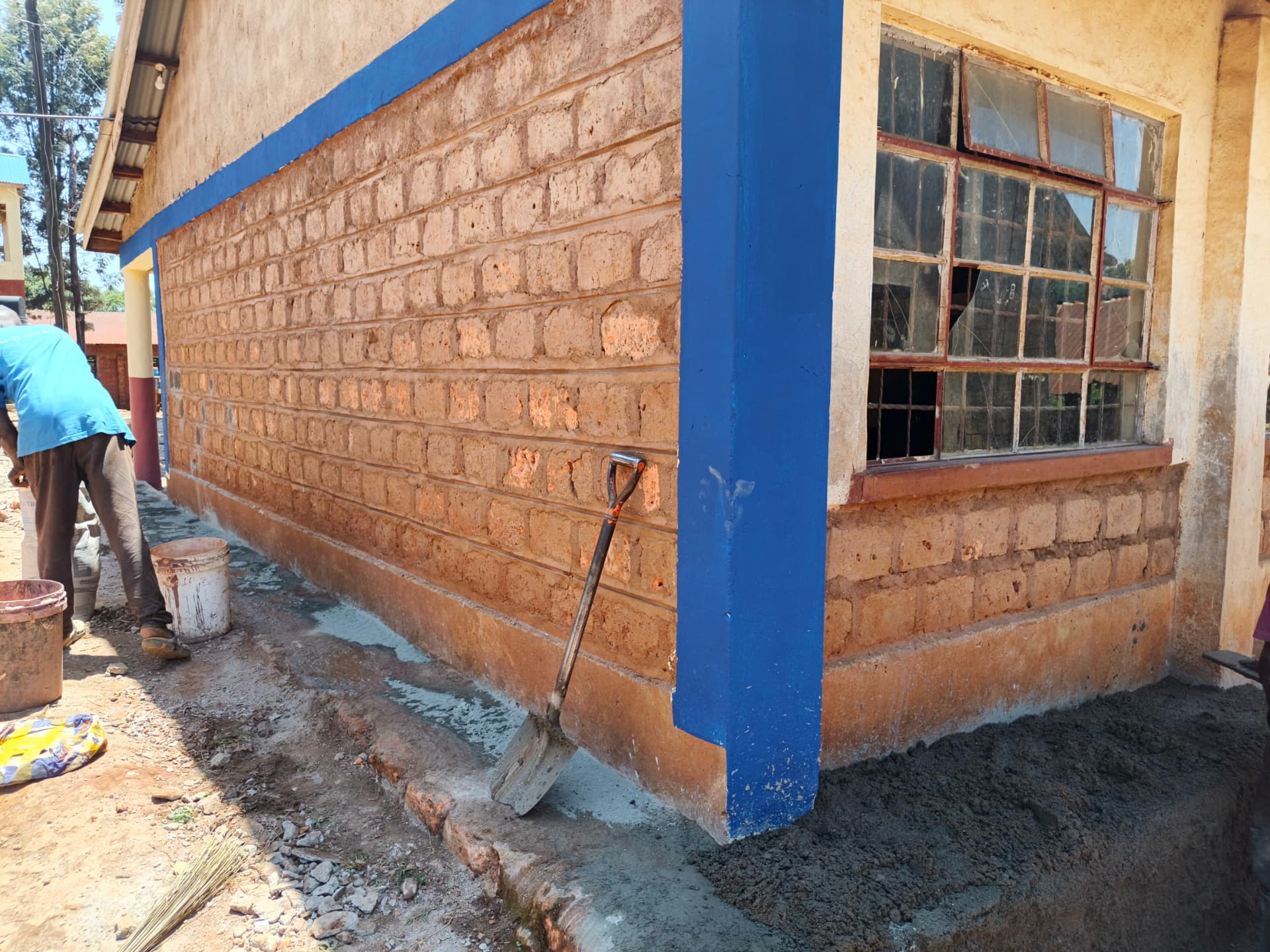 Classroom corner with new blue pillar paint and fresh cement plinth
