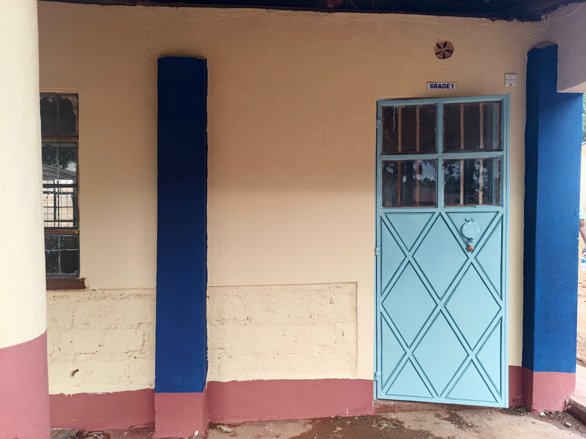 Grade 1 entrance with repainted walls and refurbished blue door