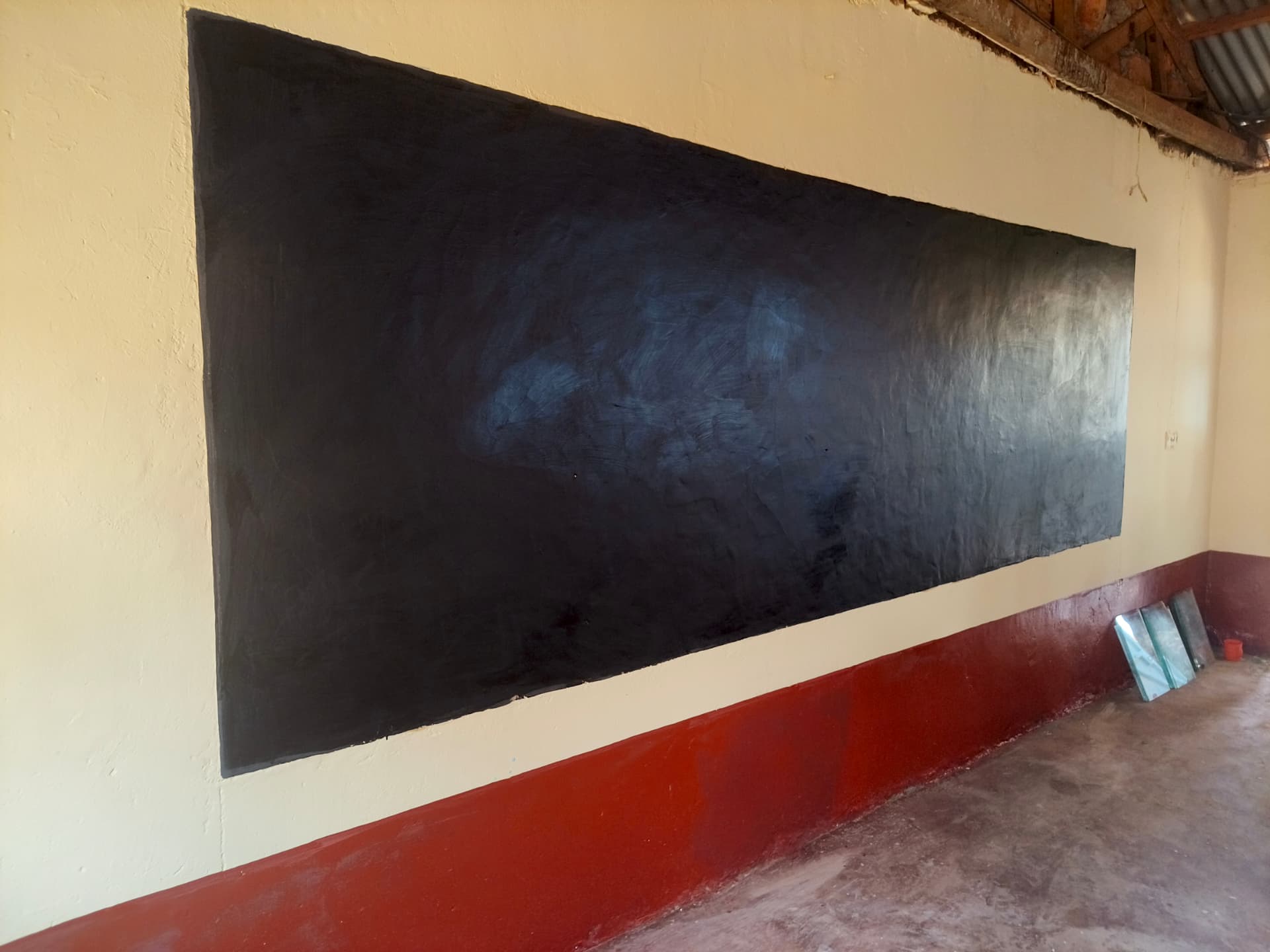 Second refurbished classroom chalkboard with fresh cream walls