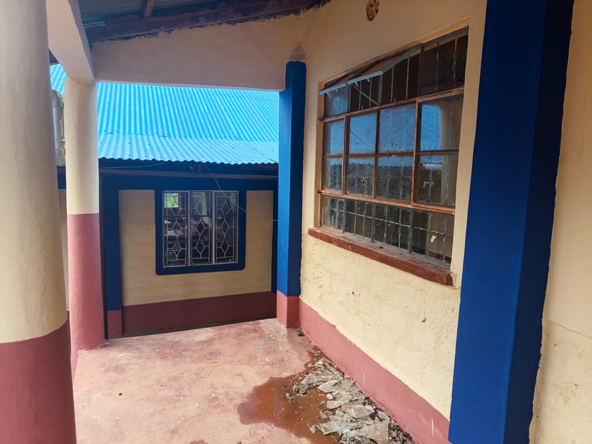 View of the new blue roof from the repainted classroom veranda