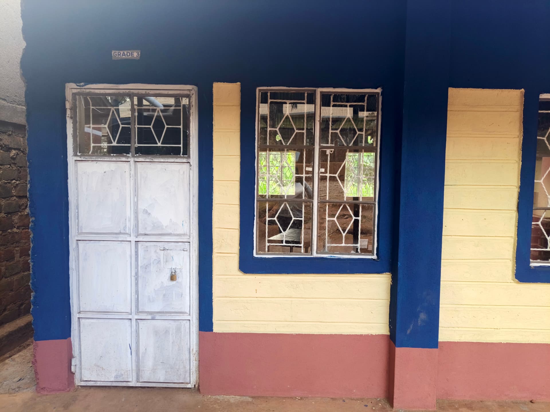Grade 3 classroom wall painted blue and cream with refurbished windows